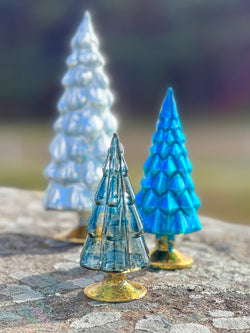wintry blue glass hue trees by Cody Foster