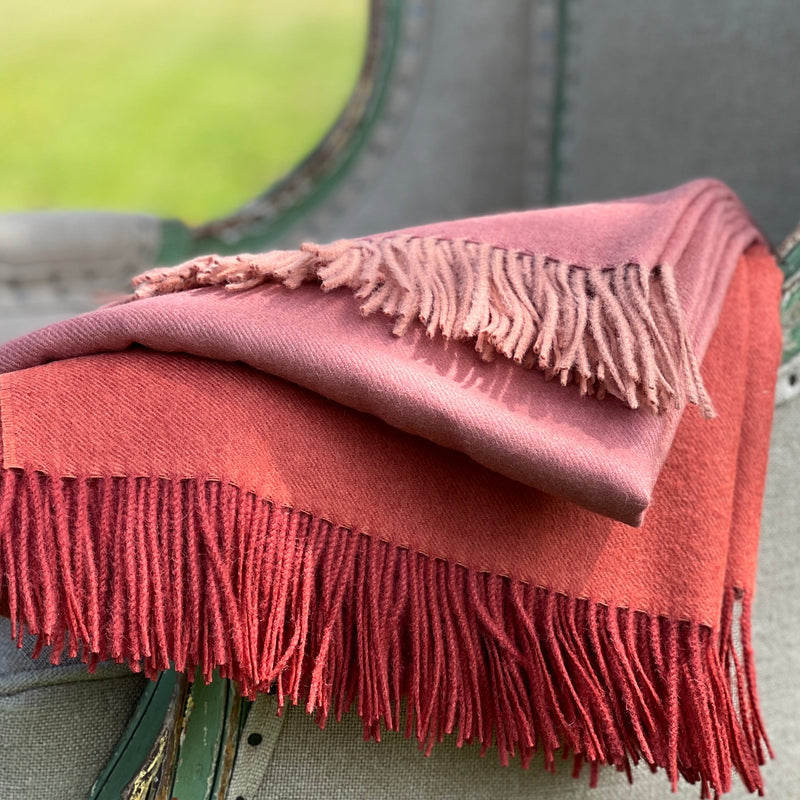 Baby alpaca throw in orange crimson