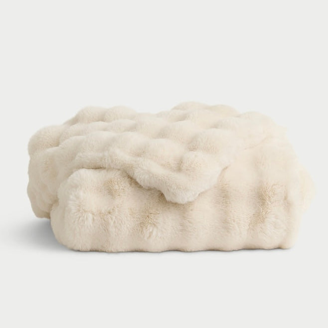 Faux fur throw blanket in cream