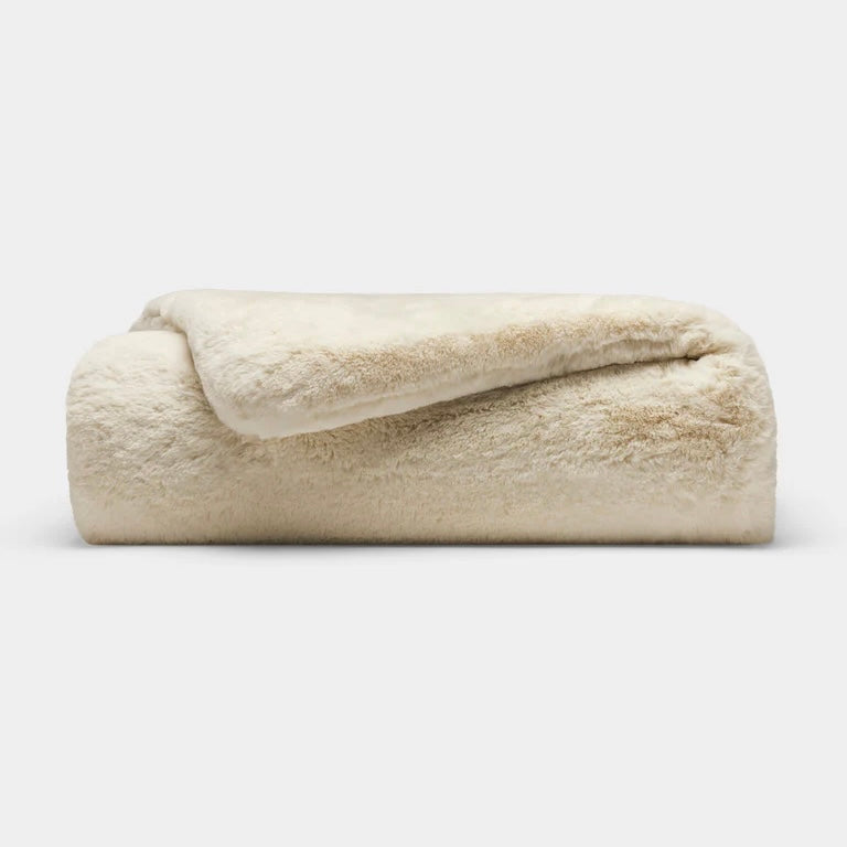 Faux fur throw blanket in cream