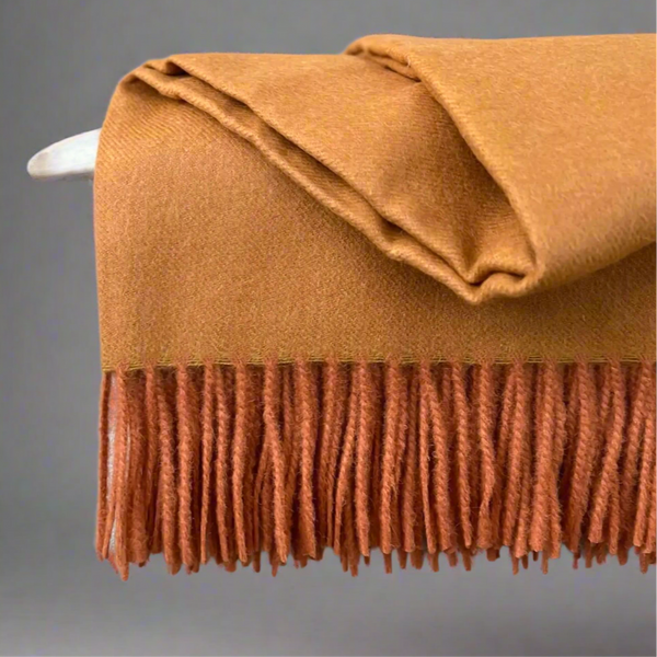 Baby alpaca throw in orange 