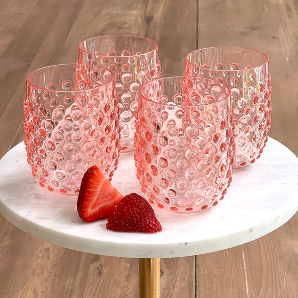 Outdoor stemless wine glasses in pink by Tar Hong