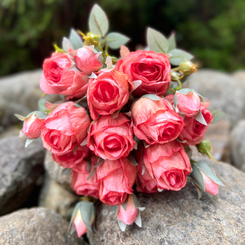 Faux flower stems in pink orange roses