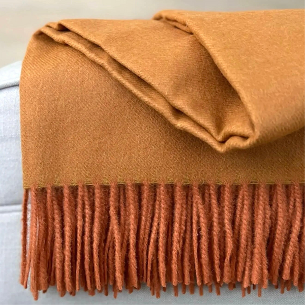 Baby alpaca throw in orange 