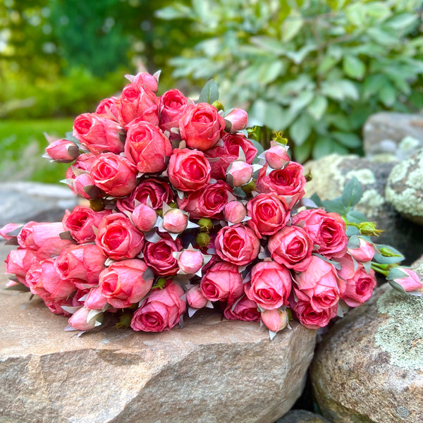 Faux flower stems in pink orange roses