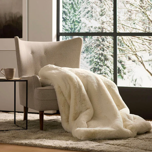 Faux fur throw blanket in cream