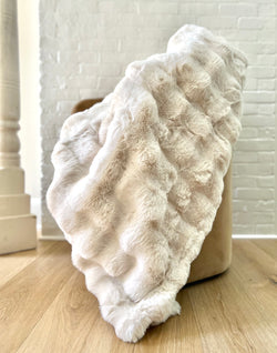 Faux fur throw blanket in cream