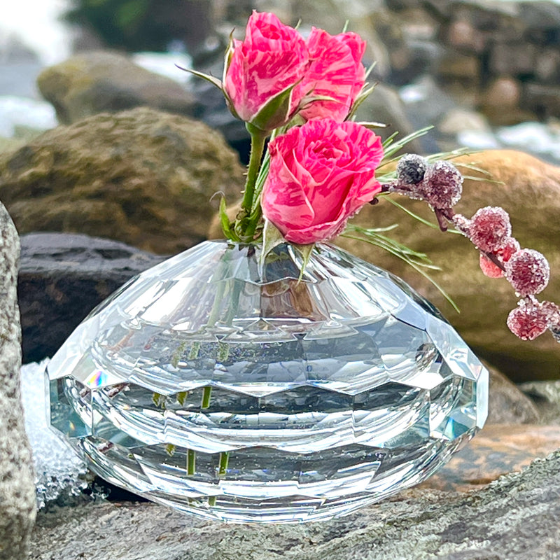 Luminous and faceted squat bud vase by Beatriz Ball