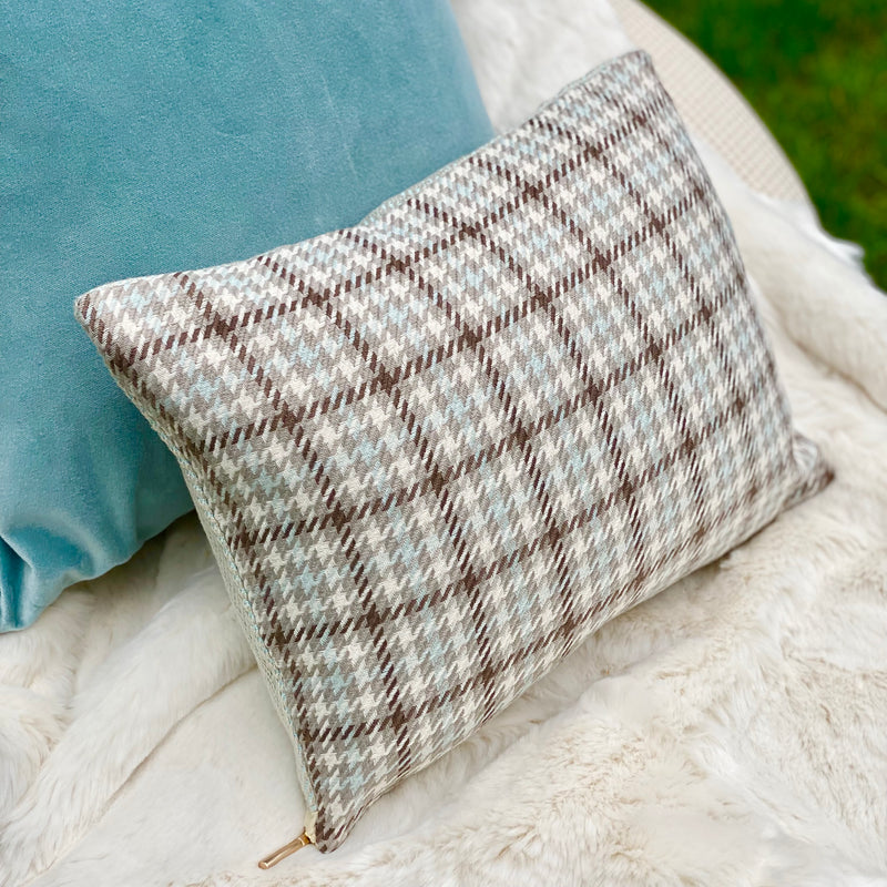chocolate, gray, cream and sky blue plaid lumbar chair pillow, backed with sky blue chevron, shown with a soft blue velvet pillow and white faux fur throw.